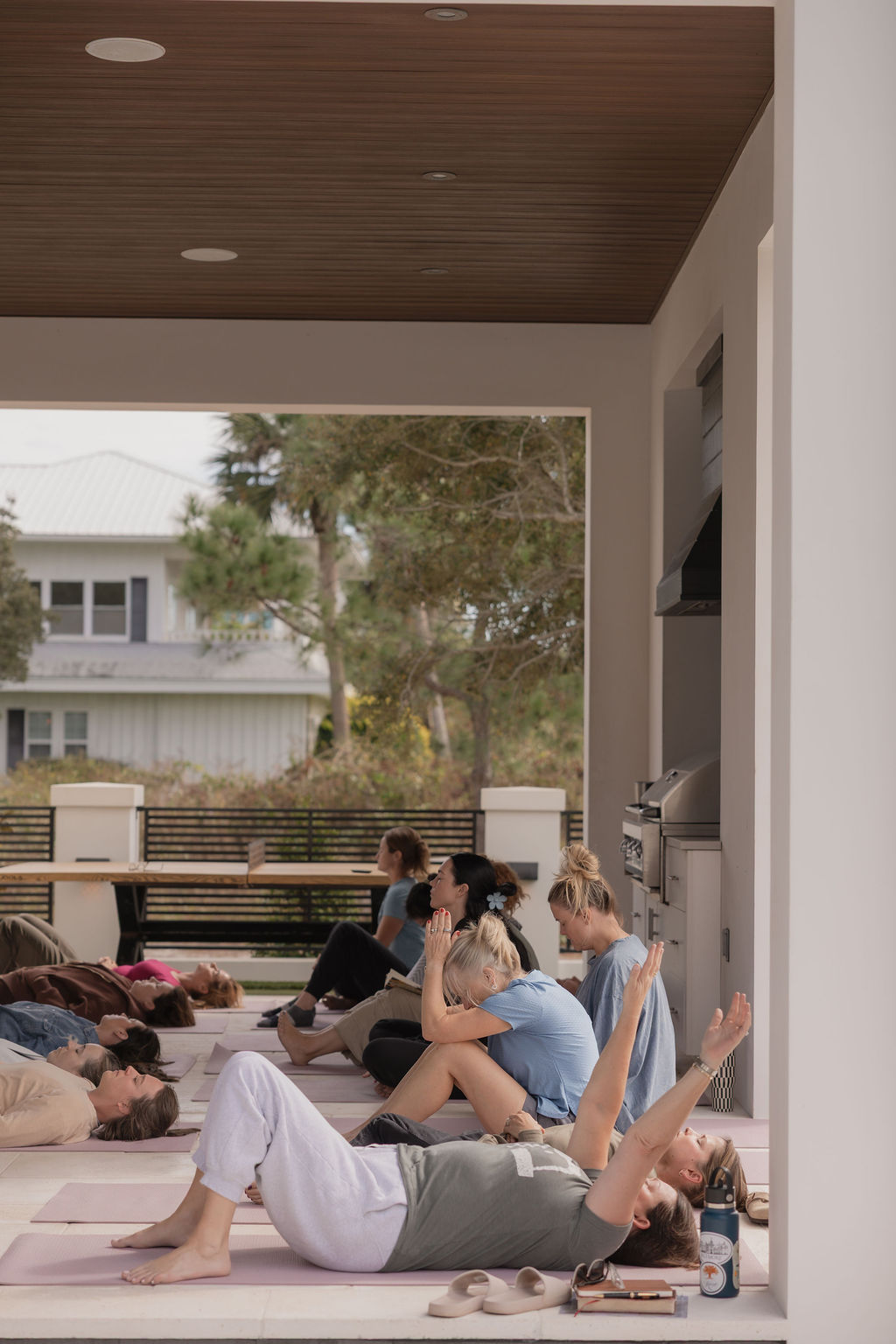 Group of women moving and resting during an outdoor Kaleo Retreats breathwork session