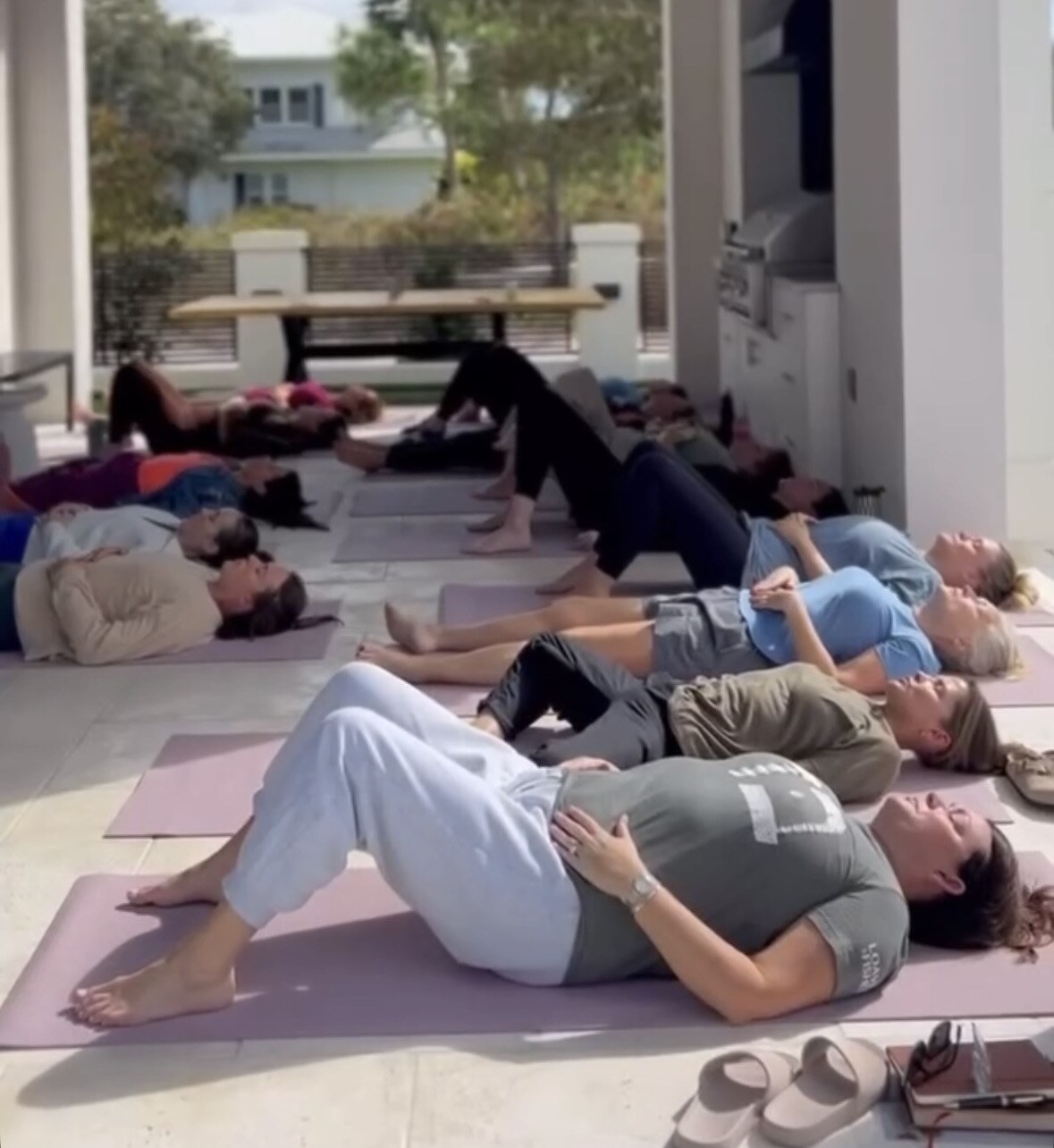 Women in deep surrender during a Kaleo Retreats breathwork session